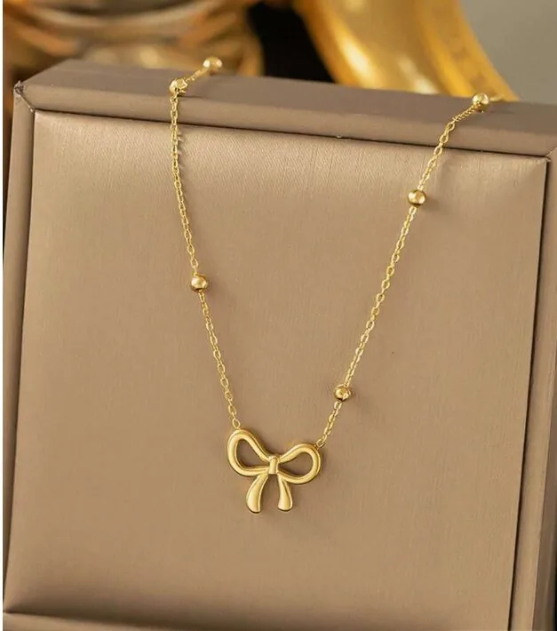 MEQAD bow necklace